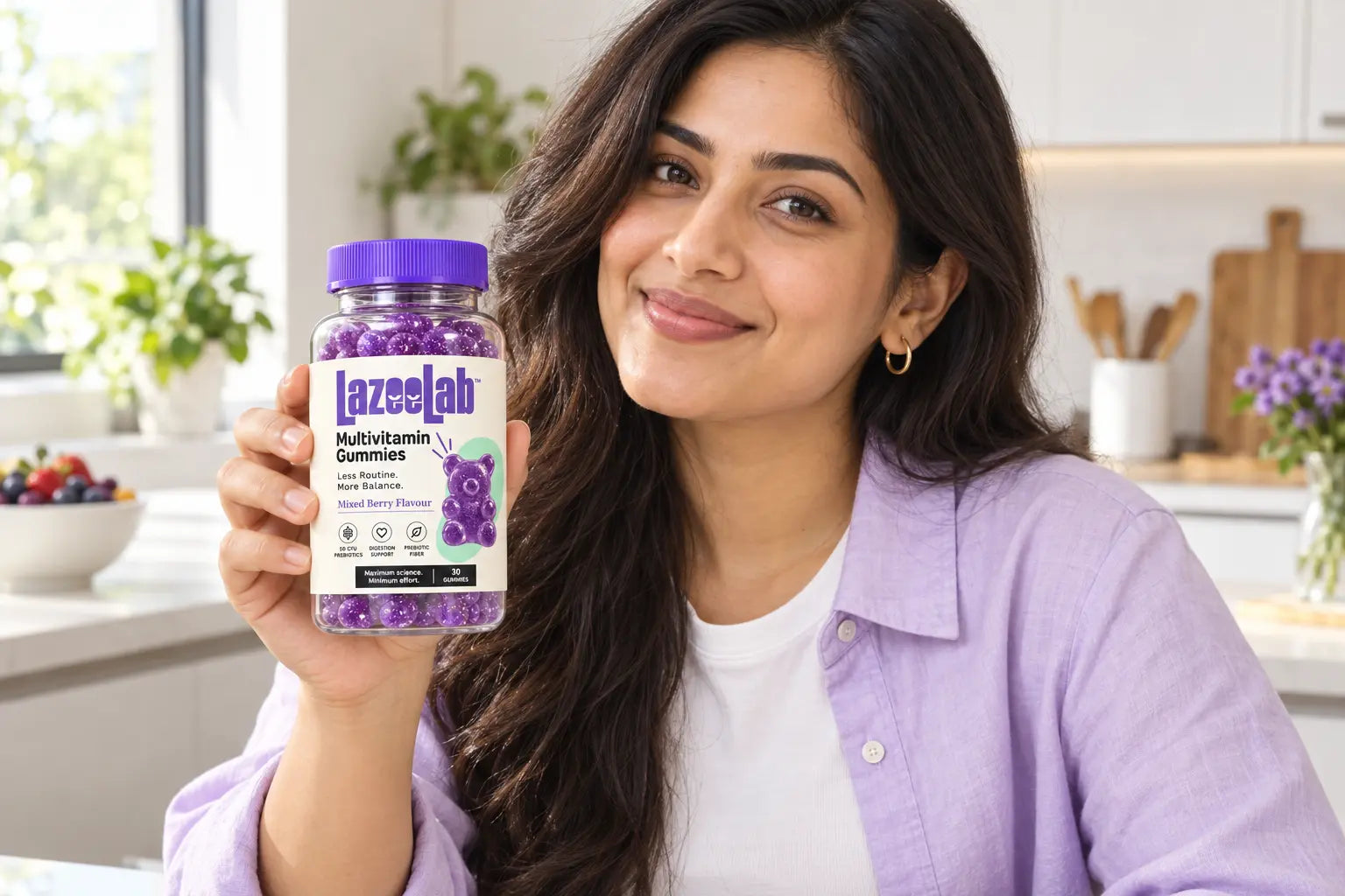 A woman holding a LazeeLab bottle in a bright kitchen